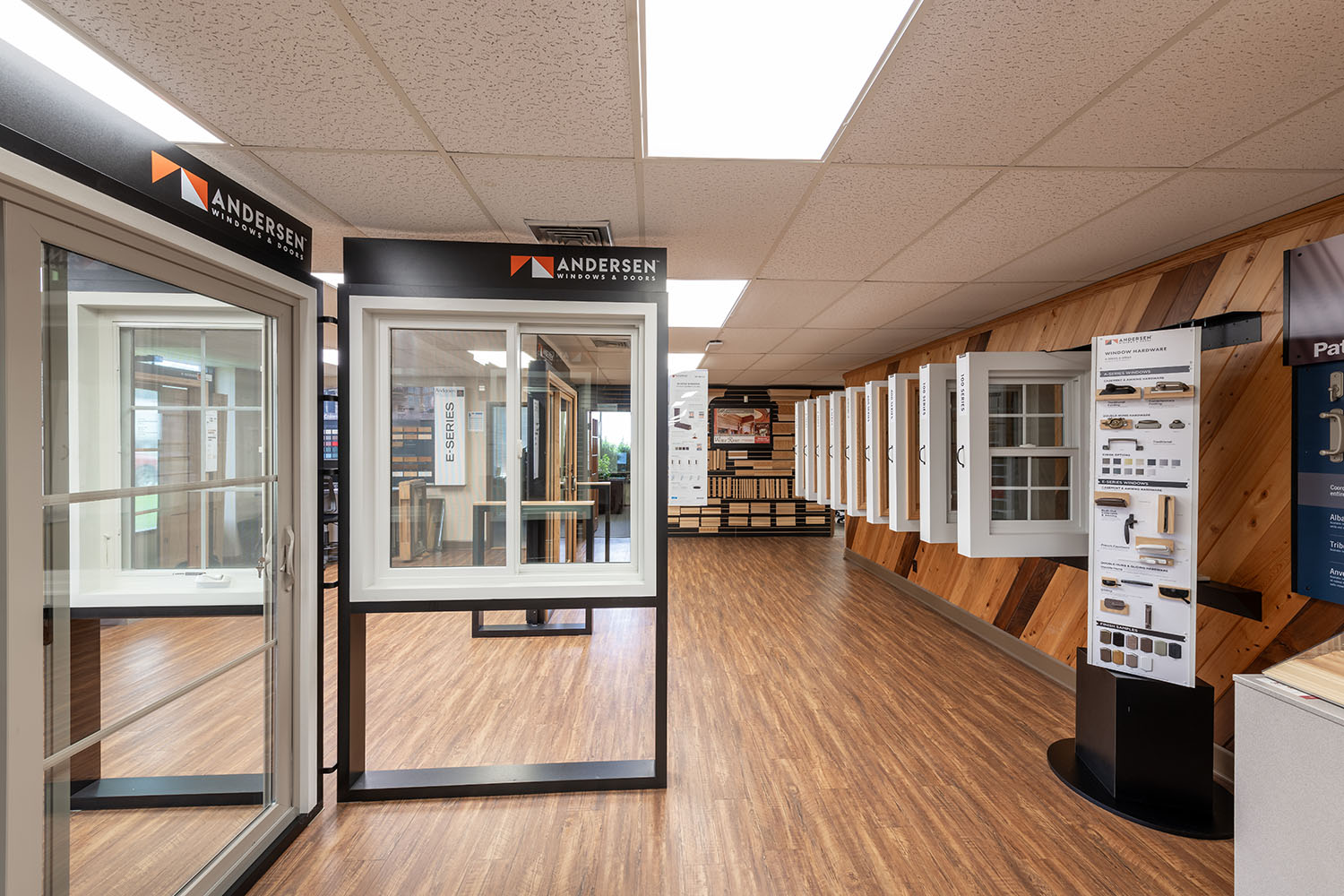 Interior view of a showroom with windows with hardwood flooring.