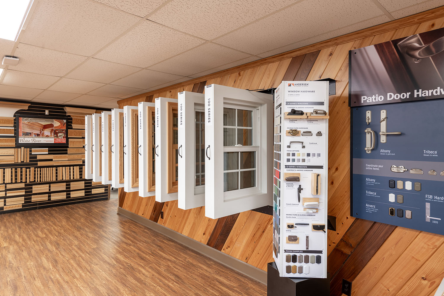 Interior view of a showroom with windows with hardwood flooring.